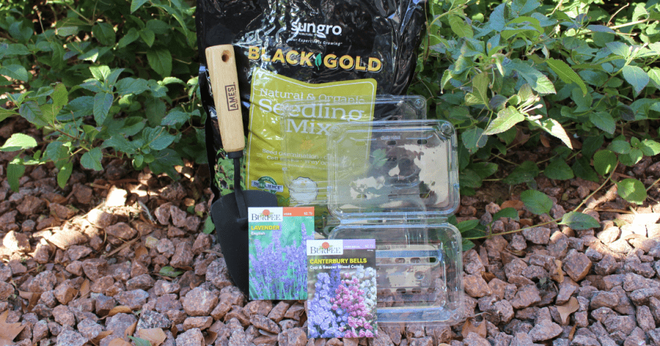 Image of SunGro's Natural and Organic Seedling Mix, Burpee seed packets, and an Ames trowel