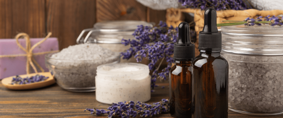 Image of lavender-scented bath and beauty products such as oils, bath salts, lotions, and soaps.