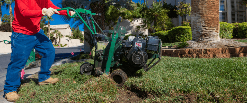 man conducting a turf removal during a landscape conversion